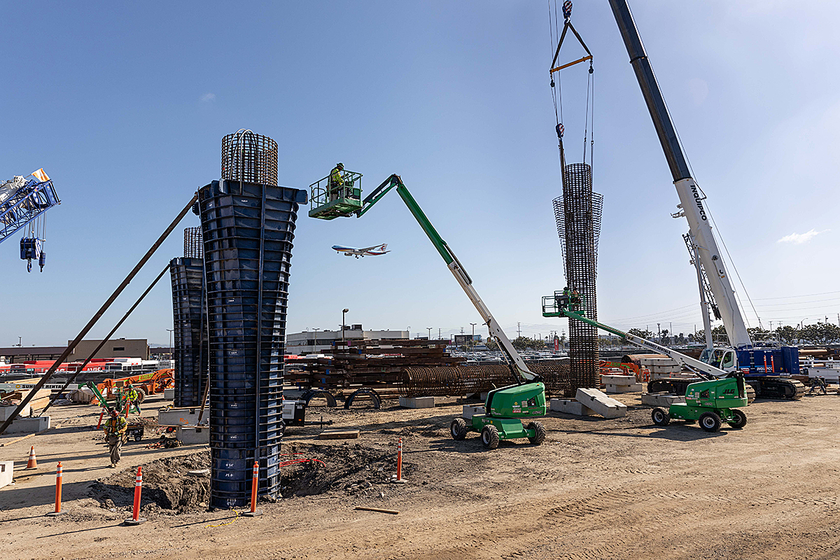Crews construct three new guideway columns approaching the Intermodal Transportation Facility-West.