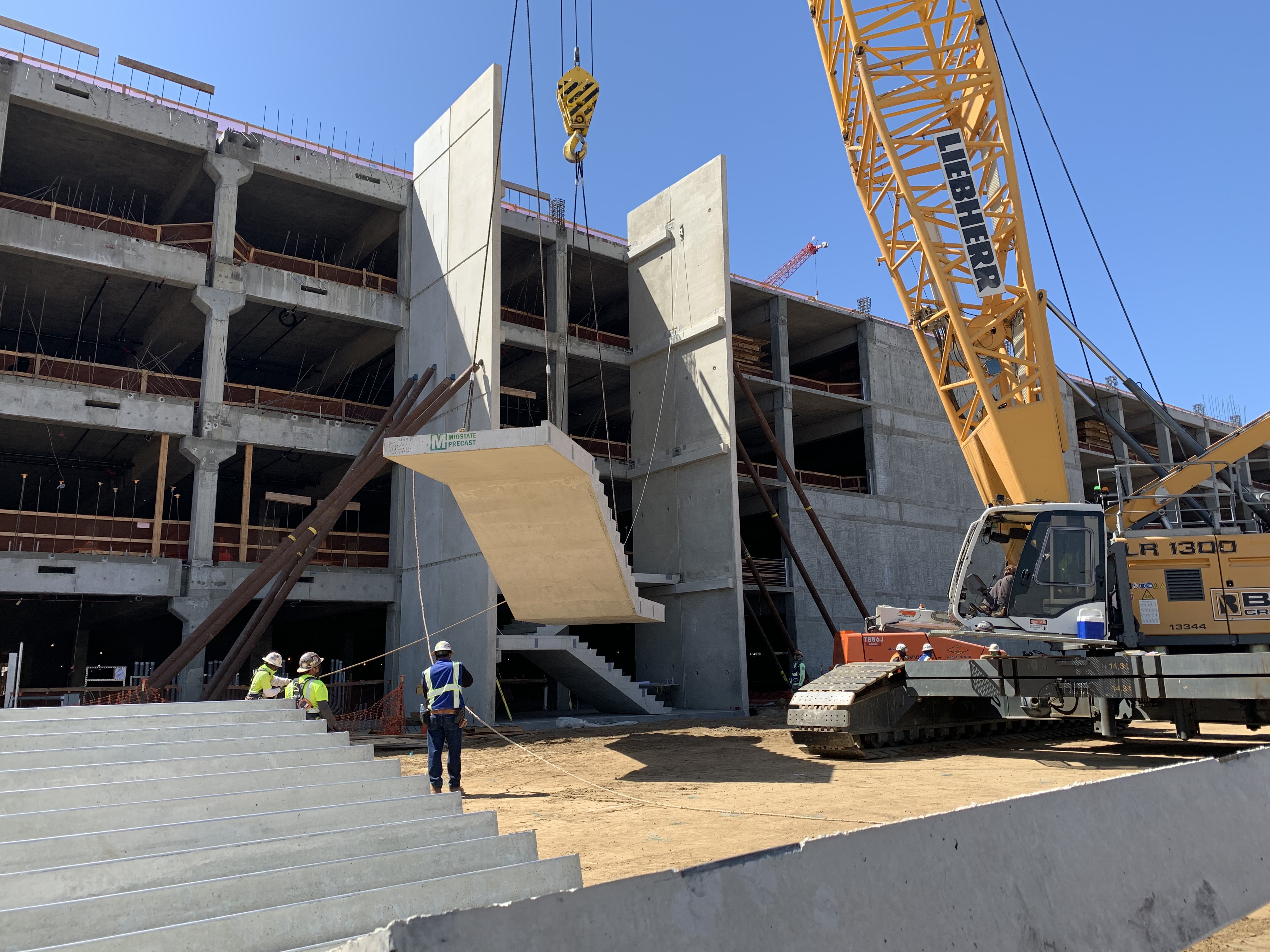 Ready Return building precast stair installation at the Consolidated Rent-A-Car facility.