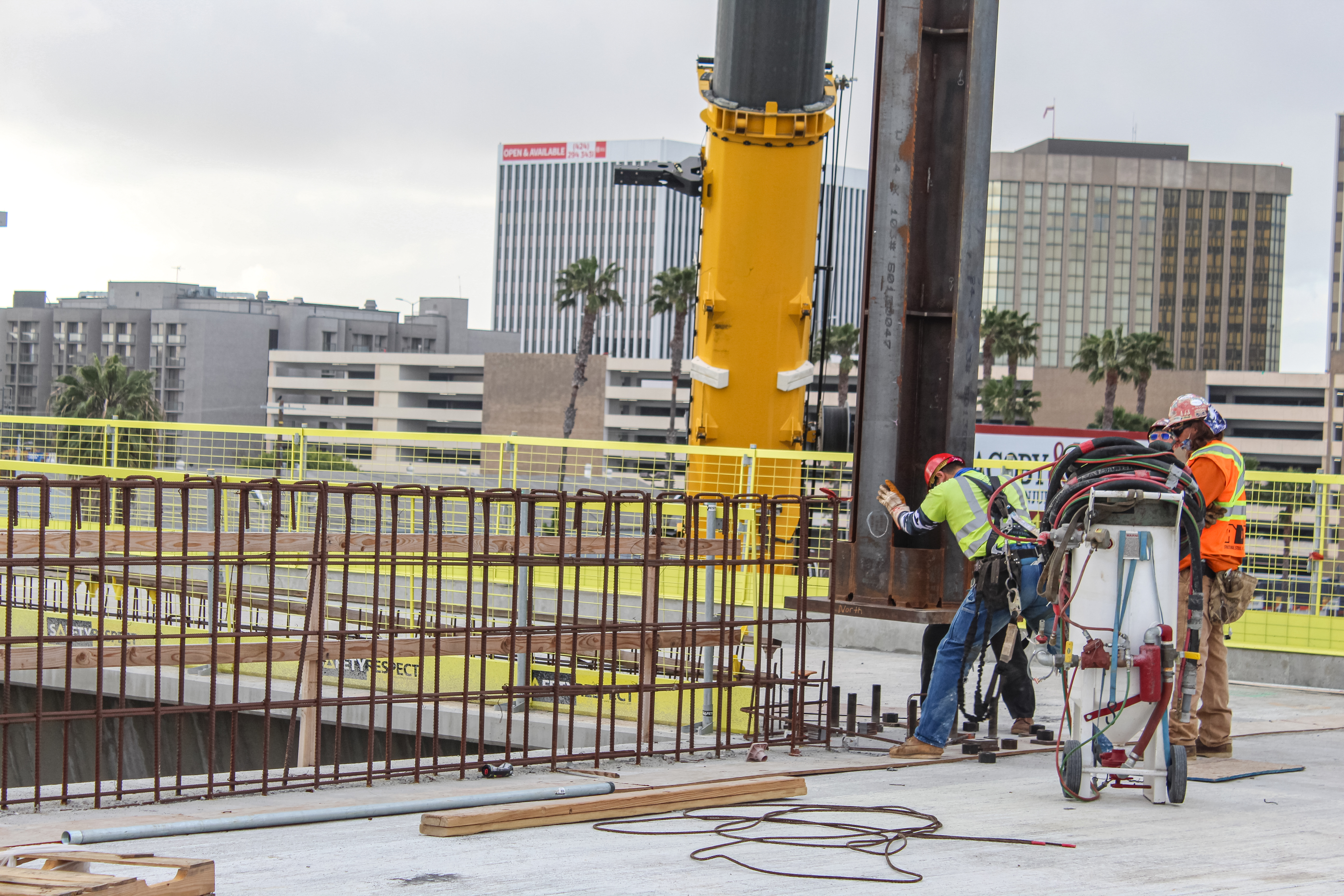Ironworkers erect steel for the station canopy at the future Intermodal Transportation Facility-West.