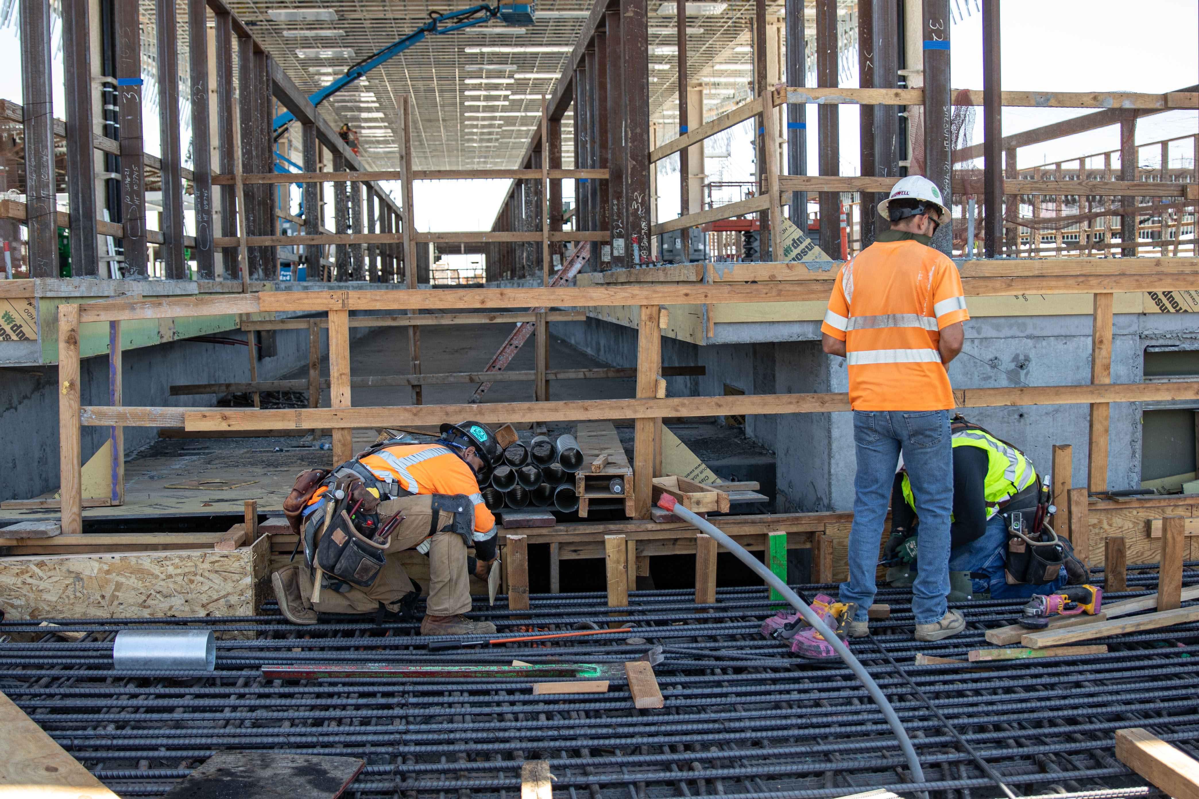 Crews work on the guideway segment that connects to the Consolidated Rent-A-Car Facility.