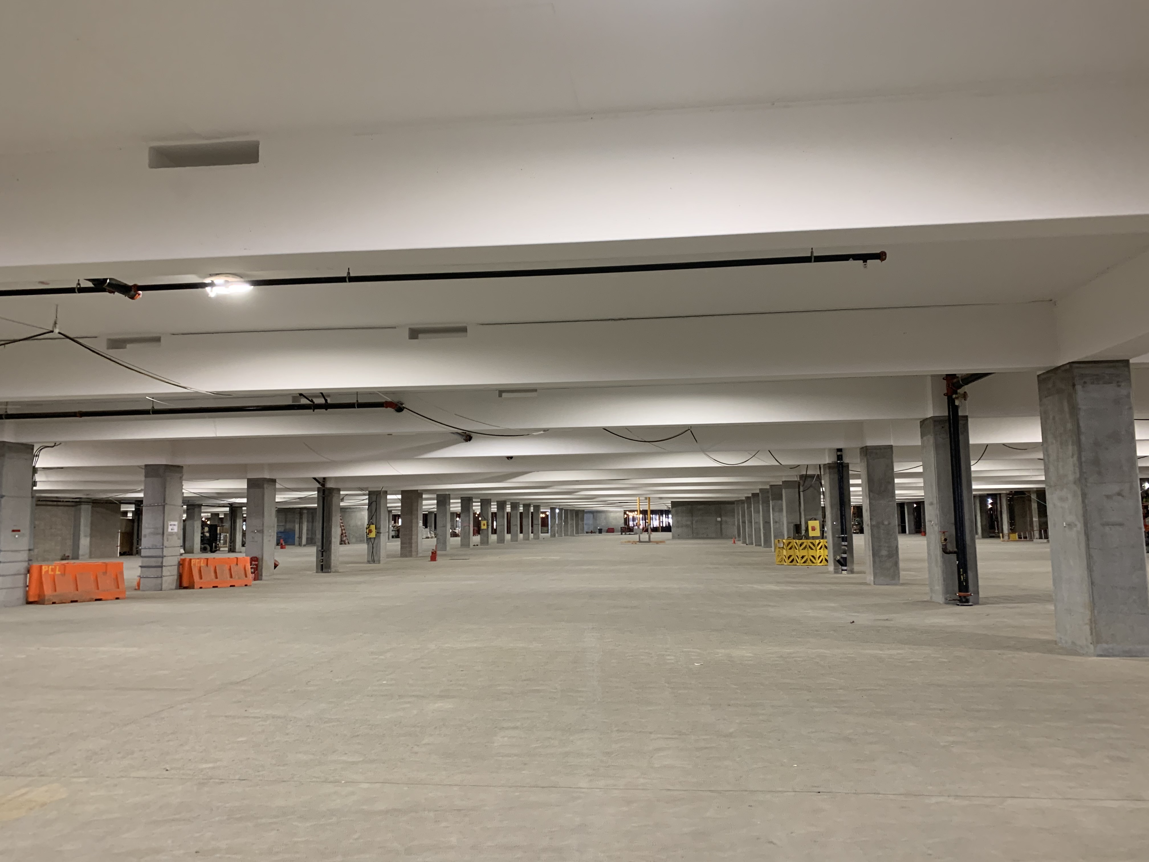 Ceiling paint and permanent lighting at lower level of the Consolidated Rent-A-Car facility.