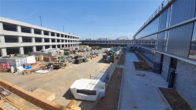 >AIRPORT POLICE FACILITY CONSTRUCTION INCLUDES FIXTURE INSTALLATION, ROAD WORK