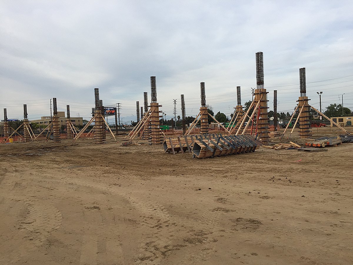 The first columns for the Quick Turn Around Building at the Consolidated Rent-A-Car facility site.