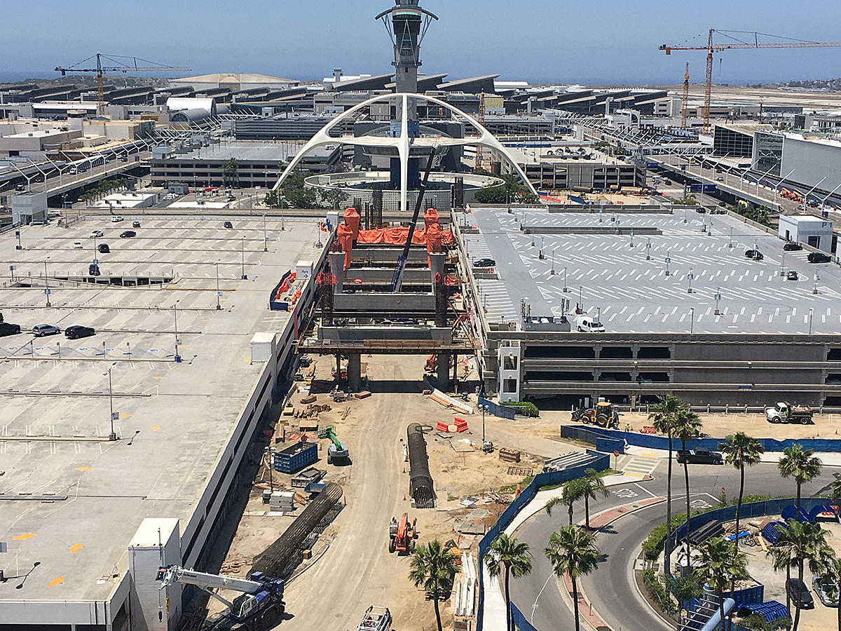 A bird’s eye view of construction of the Automated People Mover East Central Terminal Area Station from the old control tower