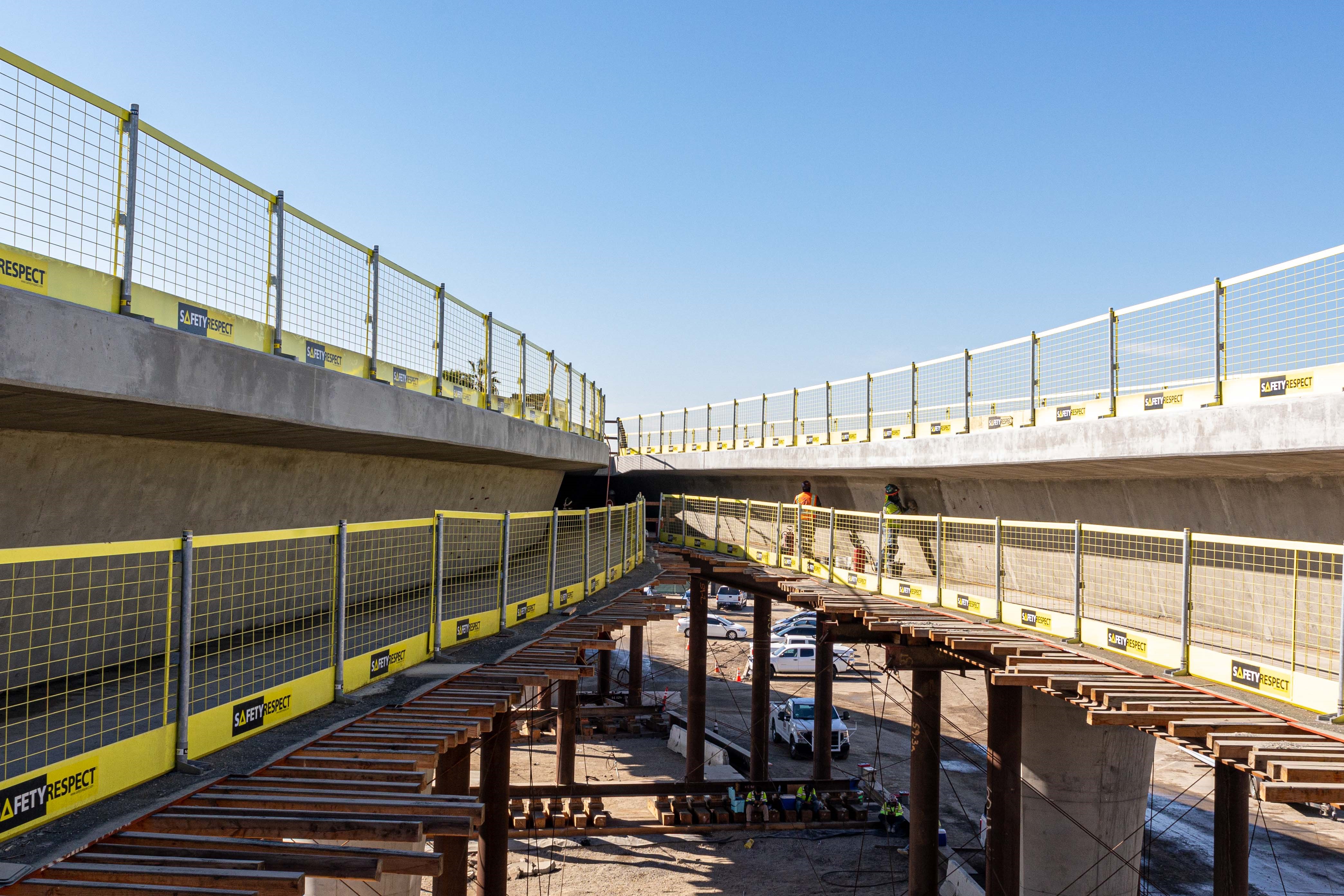 Just west of the future Intermodal Transportation Facility-West station, formwork has been stripped revealing the first segment of completed guideway superstructure.