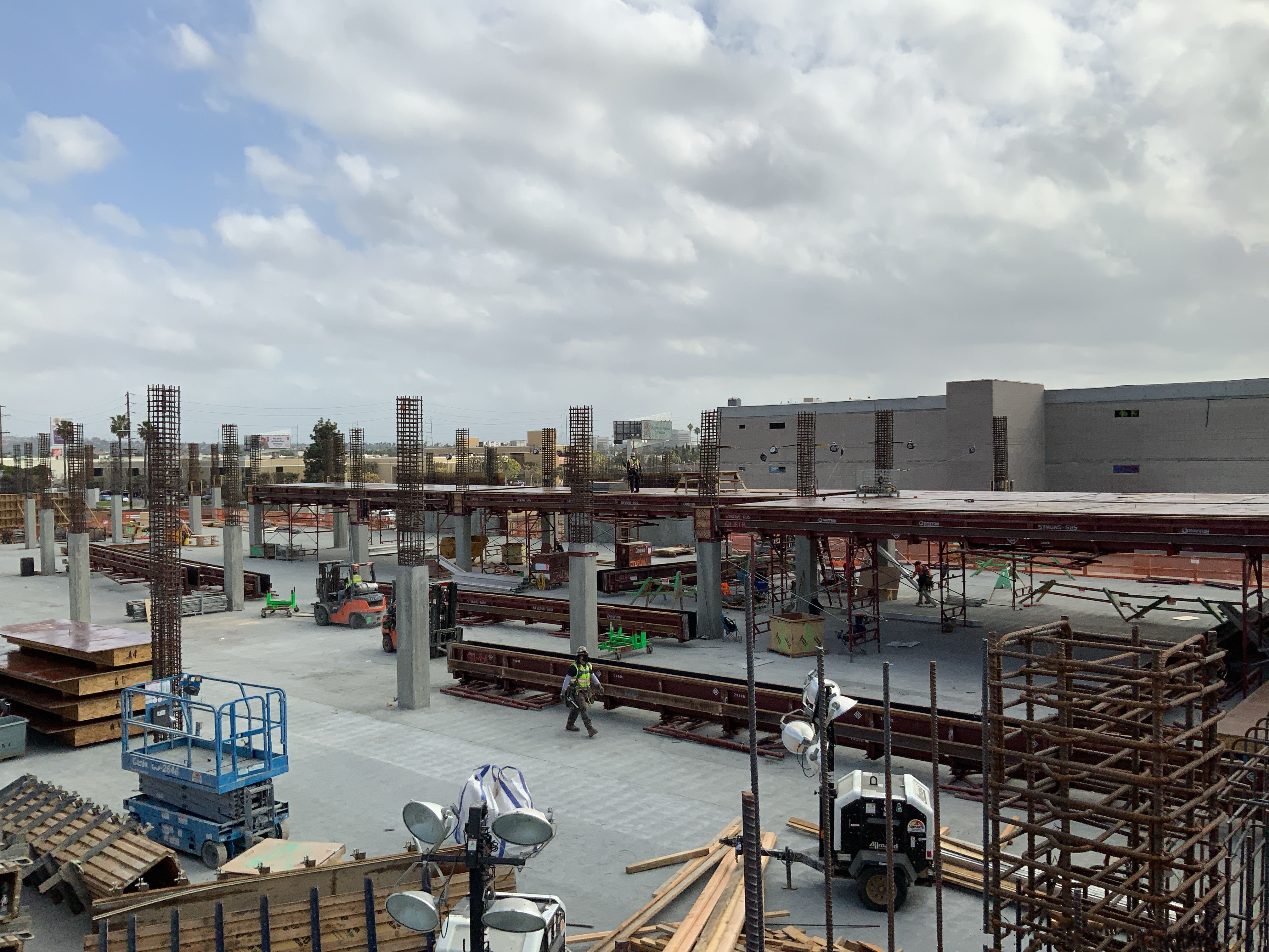 Installation of beams and tables on the third level of Idle Storage building at the Consolidated Rent-A-Car facility.