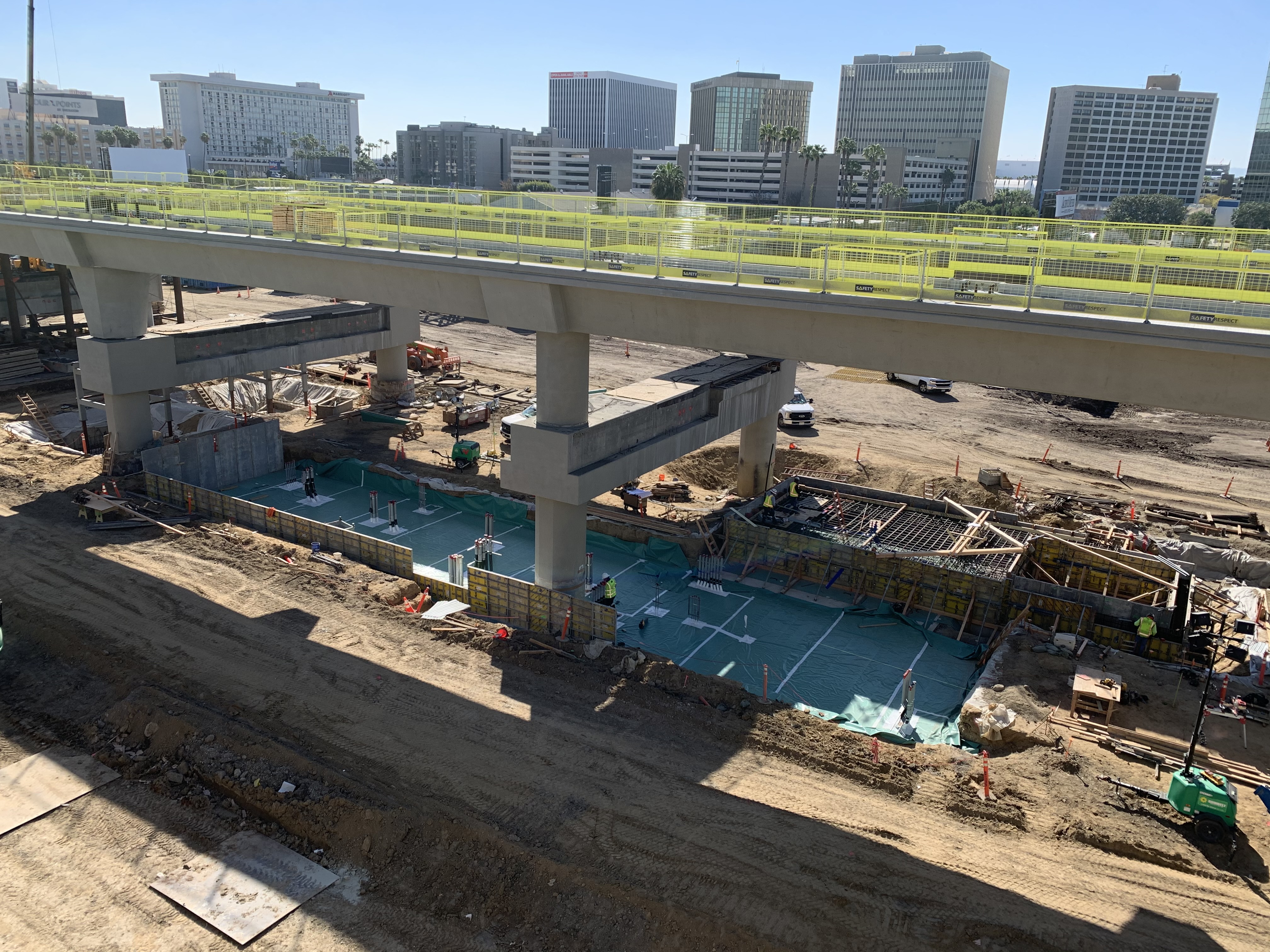 A view of the Intermodal Transportation Facility-West station construction and Automated People Mover guideway.