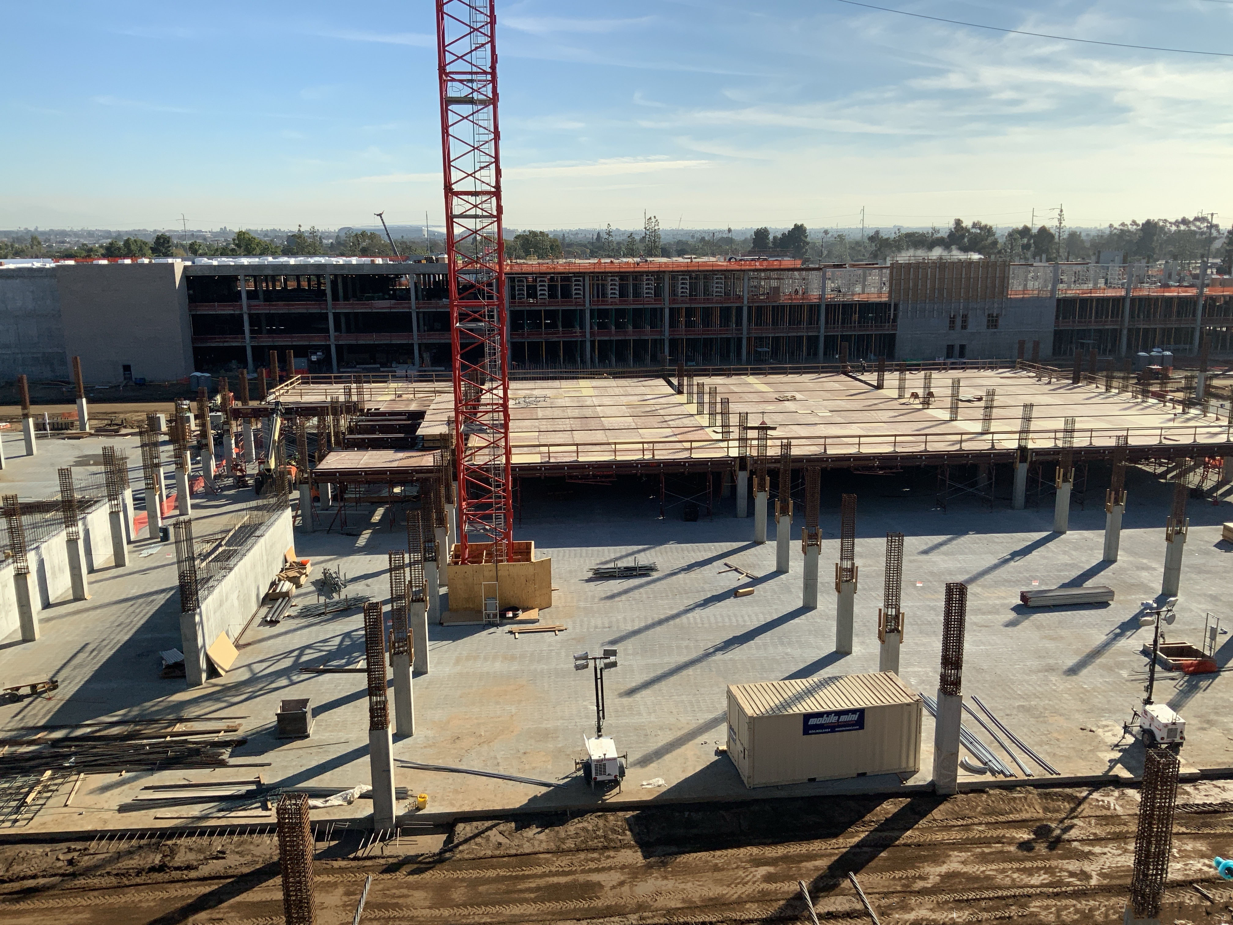 Beams and tables being installed to complete the deck formwork in preparation for the first second level deck pour at the Consolidated Rent-A-Car (ConRAC) facility Idle Storage (IS) building. 