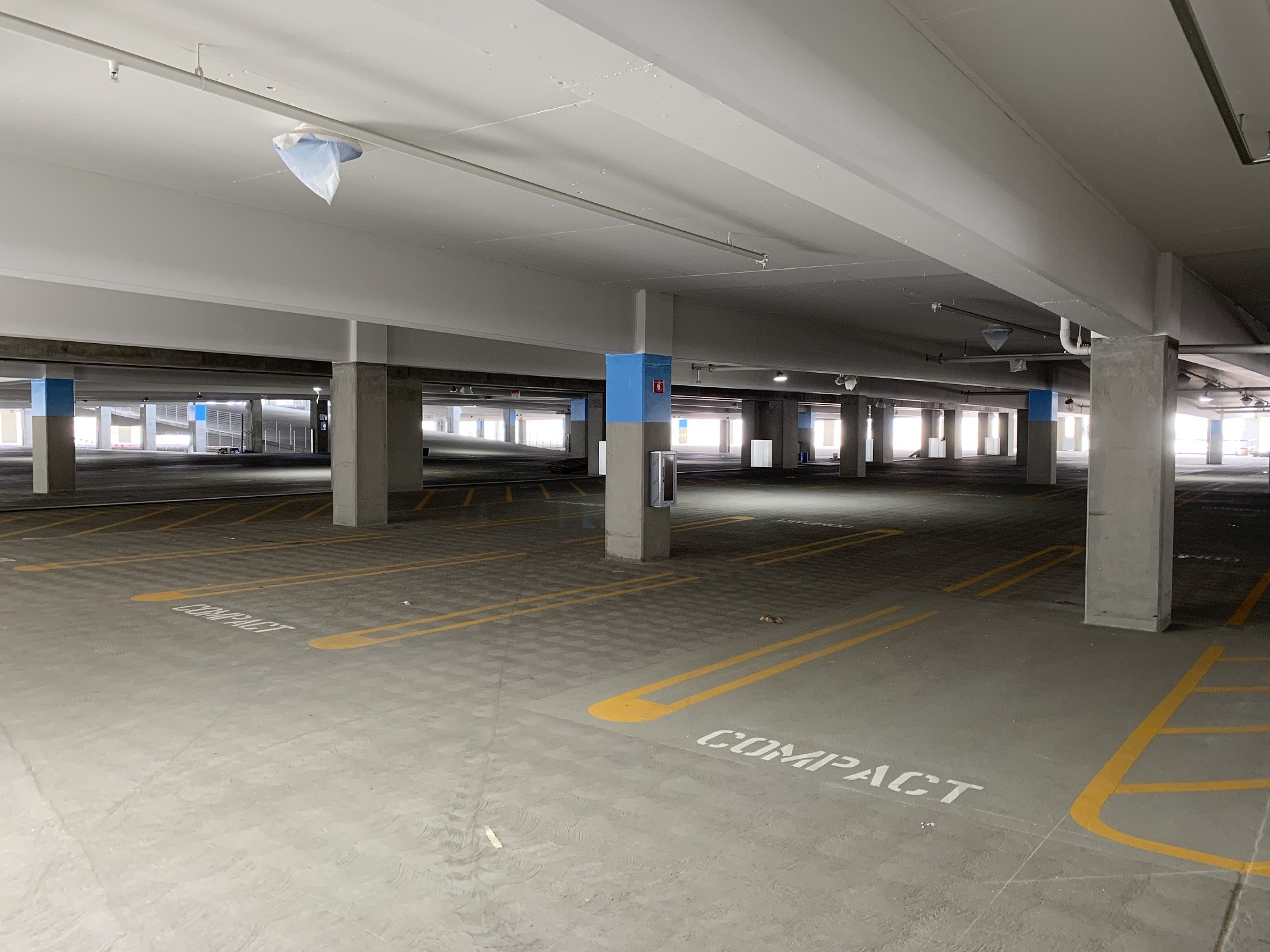 Interior painting for wayfinding and parking spot delineation continues at the Intermodal Transportation Facility-West.