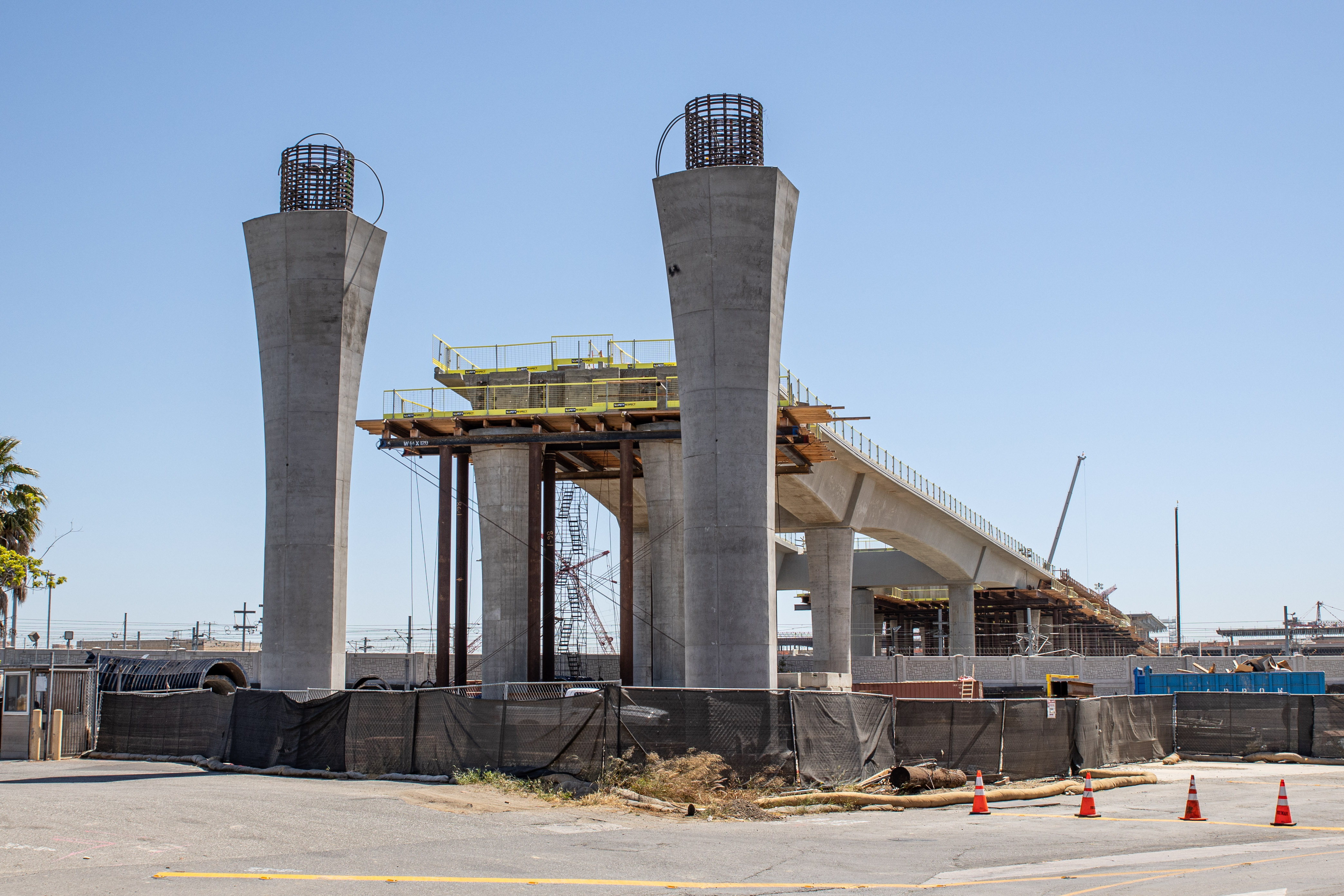 The columns along 96th Street stand ready for guideway construction to commence along the street. 