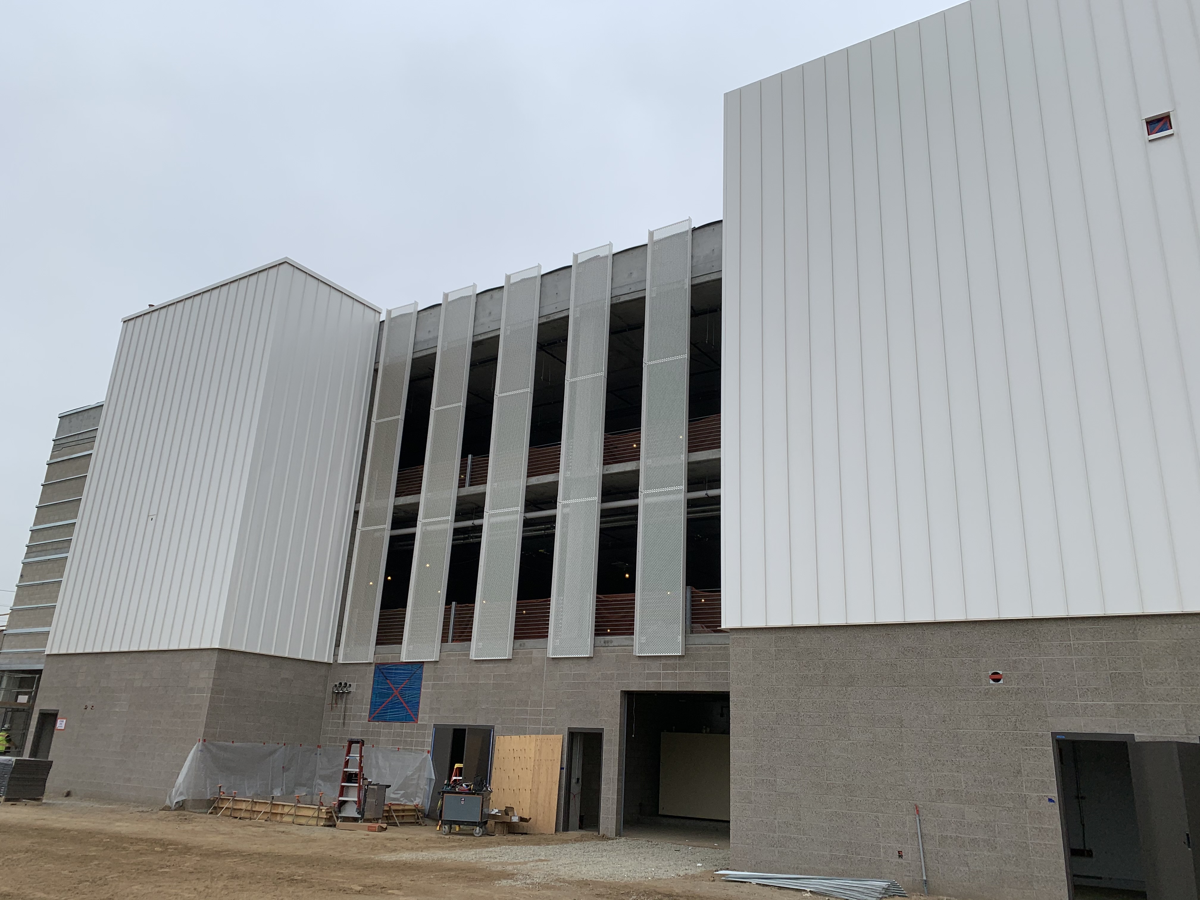 Exterior façade installation at the Consolidated Rent-A-Car facility Quick Turn Around building.