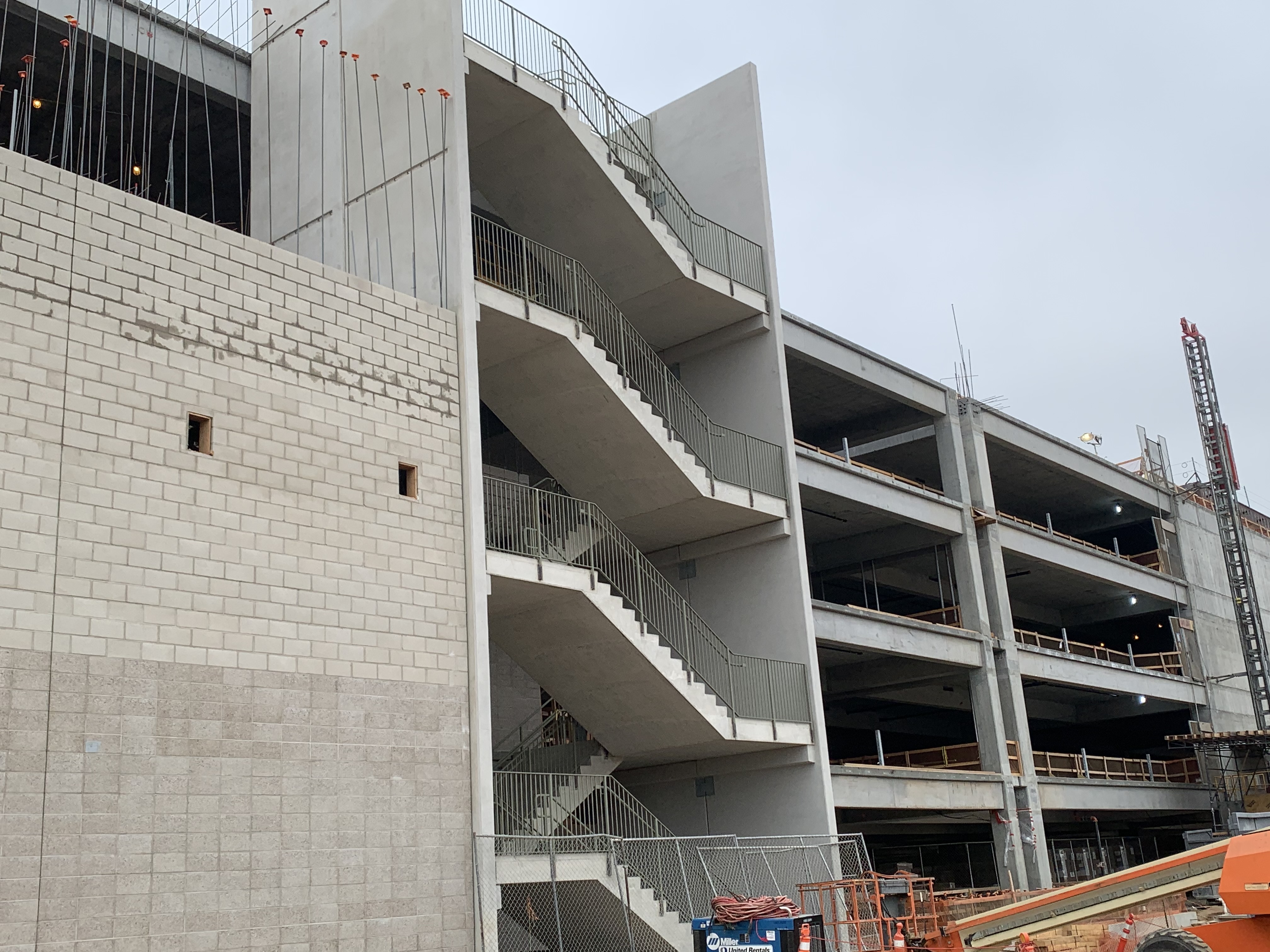 Railing installation on the precast stairs at the Consolidated Rent-A-Car facility’s Ready Return building.