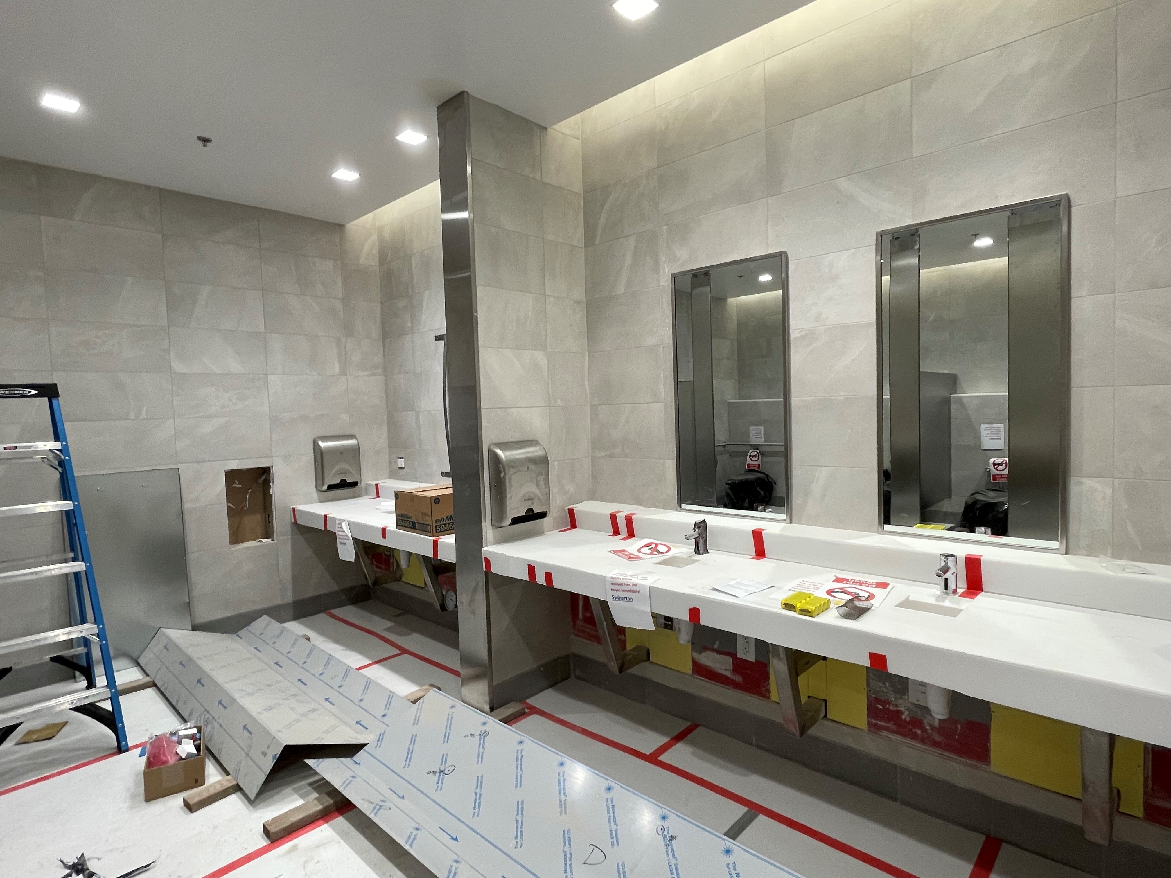 Finishing work, including tiling in public restrooms, continues at the Intermodal Transportation Facility-West.