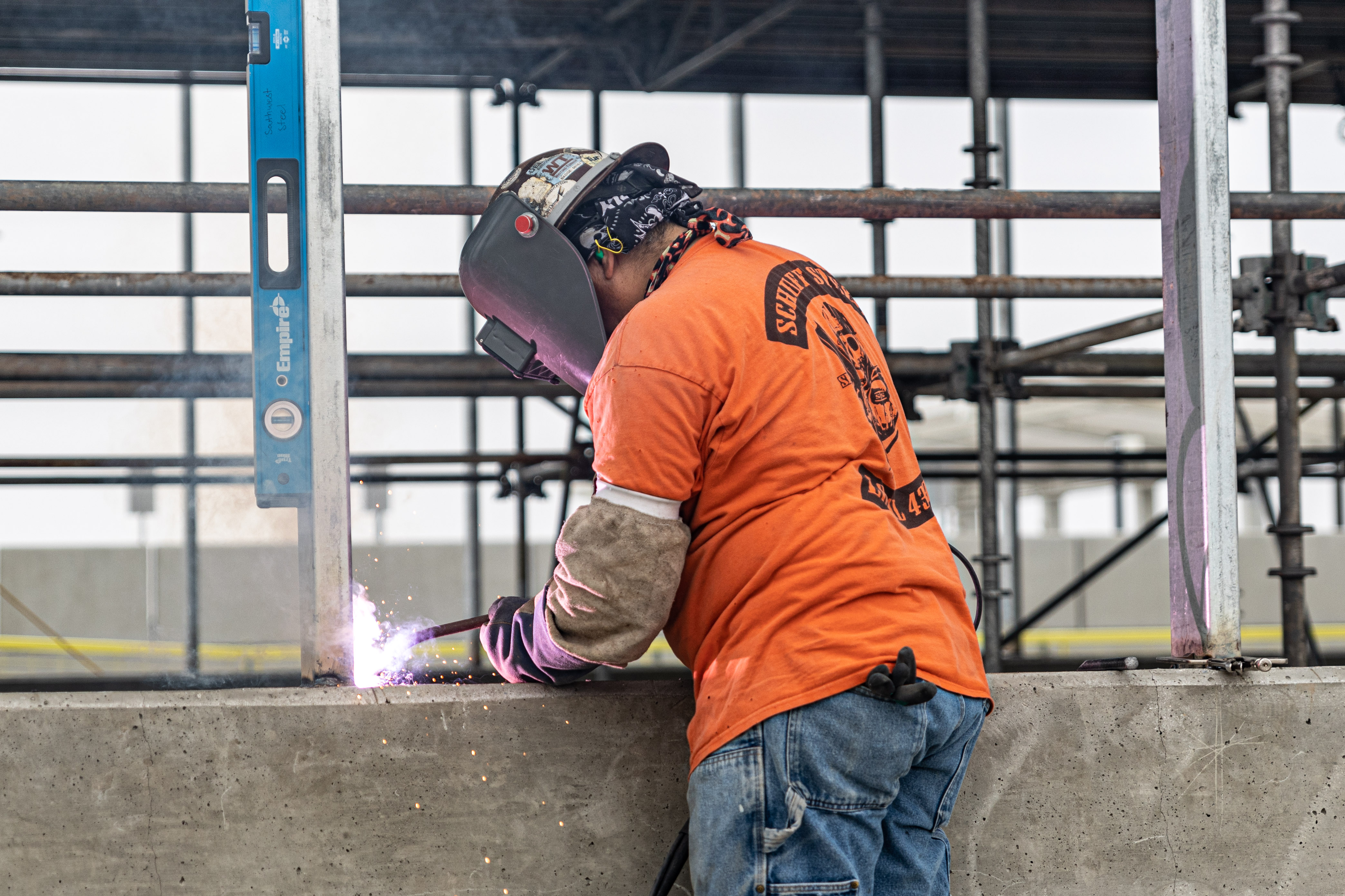 A welder works on the steel window frames at the Intermodal Transportation Facility-West Station.