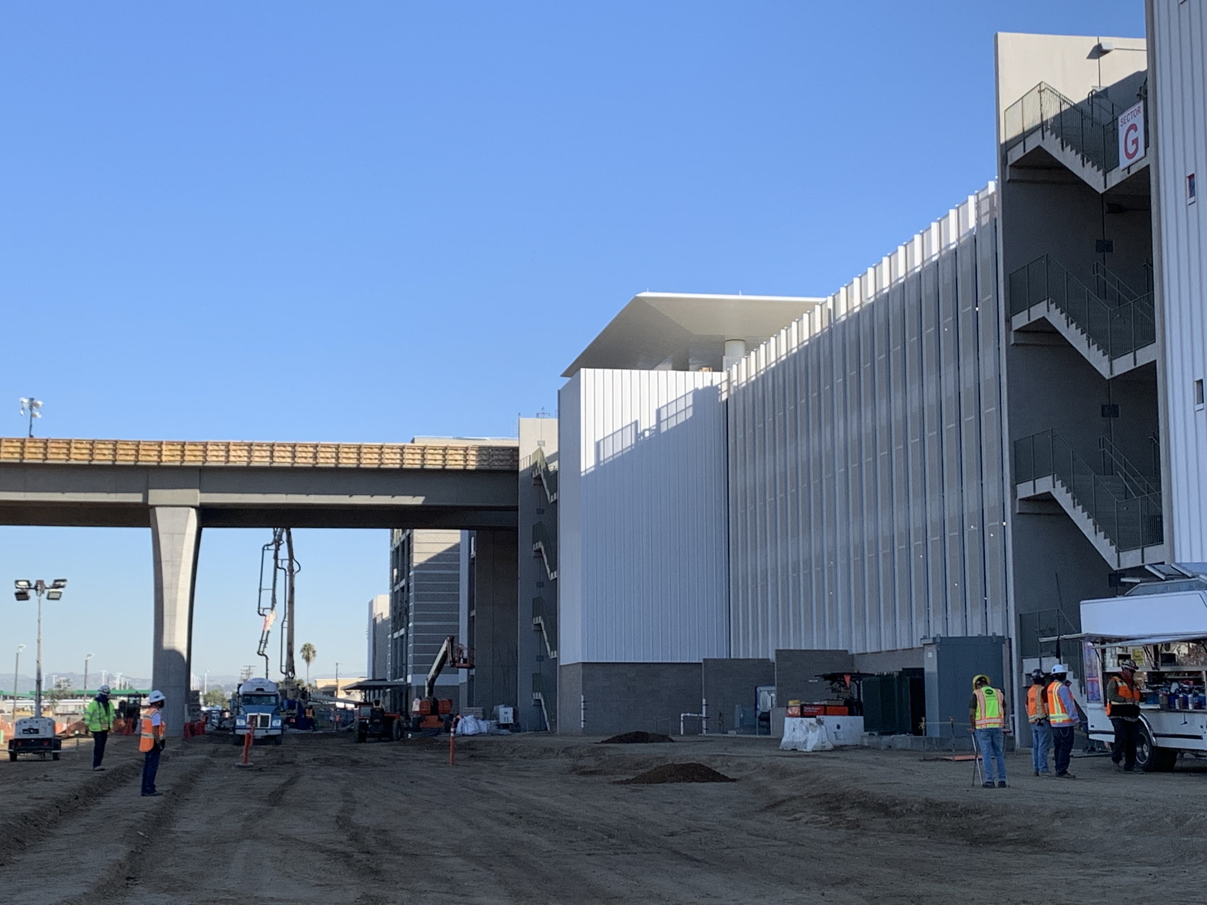 Looking north at the Automated People Mover guideway leaving the Consolidated Rent-A-Car facility Ready Return building.