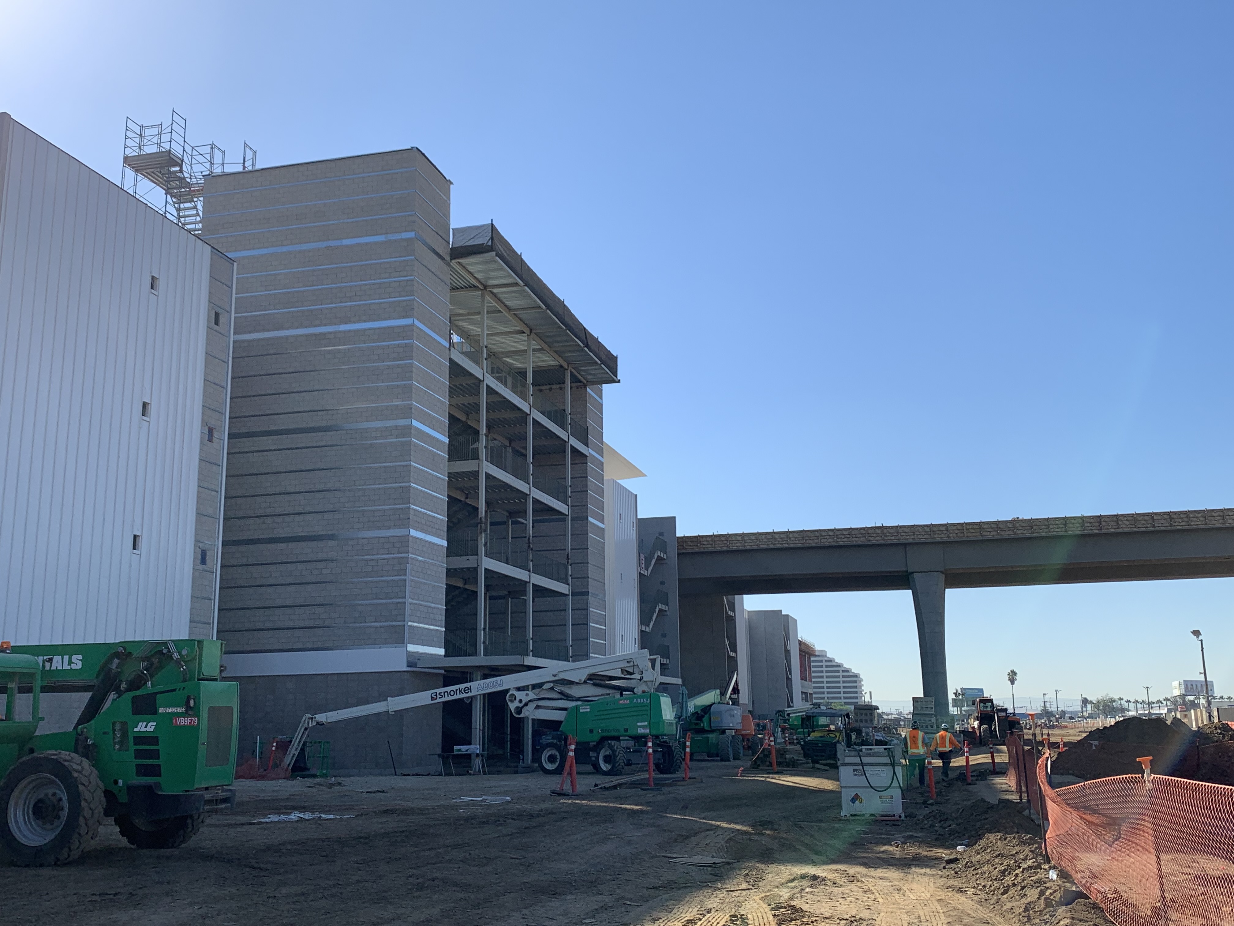 Looking south at the Automated People Mover guideway leaving the Consolidated Rent-A-Car facility Ready Return building.