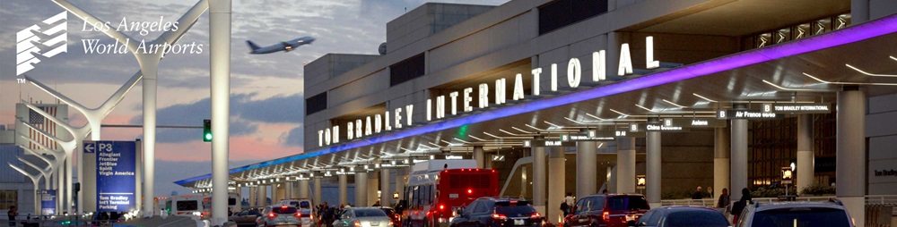 Nightshot of Tom Bradley International Terminal, cars are breaking outside of the building