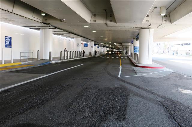 The curb between the inner and outer lanes on the Lower/Arrivals Level at Terminal 2 is scheduled to be widened by 4 feet in mid-September.