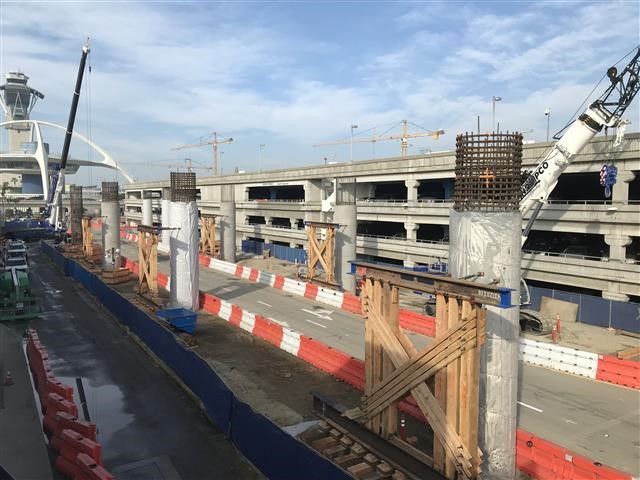 The first columns for the Automated People Mover train guideway are now in place between Parking Structures 1 and 7