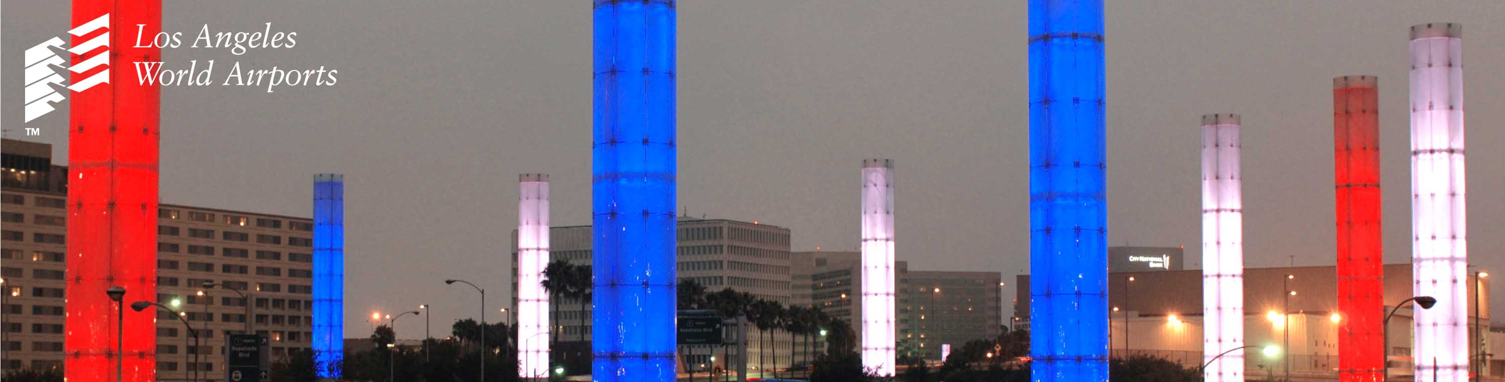 Photo of famous LAX Pillars each in red, white, or blue.