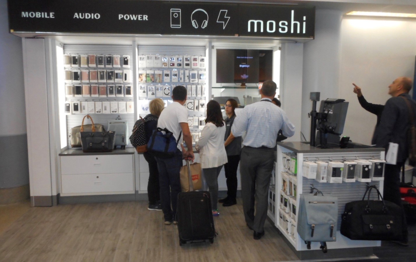 Travelers Browsing at Moshi's Display